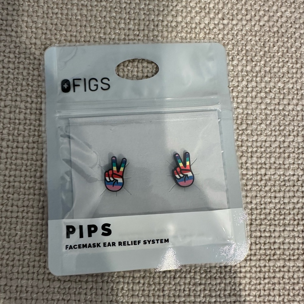 FIGS facemask relief buttons